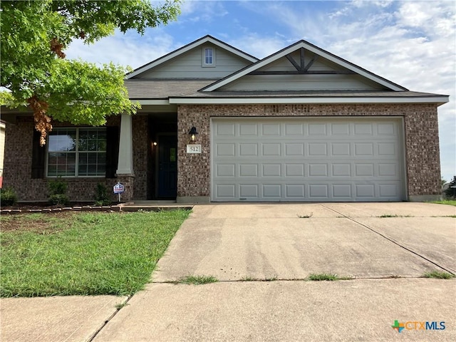 512 Constellation Dr, Killeen, TX 76542 - view of front of house featuring driveway, brick siding, a garage, and a front yard