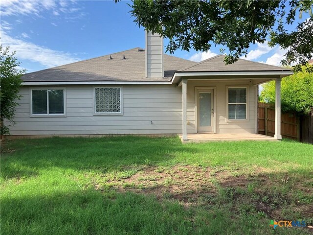 512 Constellation Dr, Killeen, TX 76542 - back of house featuring a patio and a chimney
