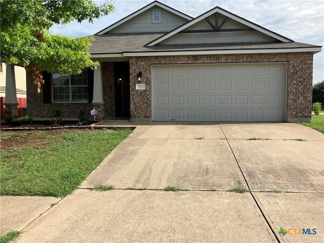 512 Constellation Dr, Killeen, TX 76542 - view of front of home with brick siding, concrete driveway, and an attached garage