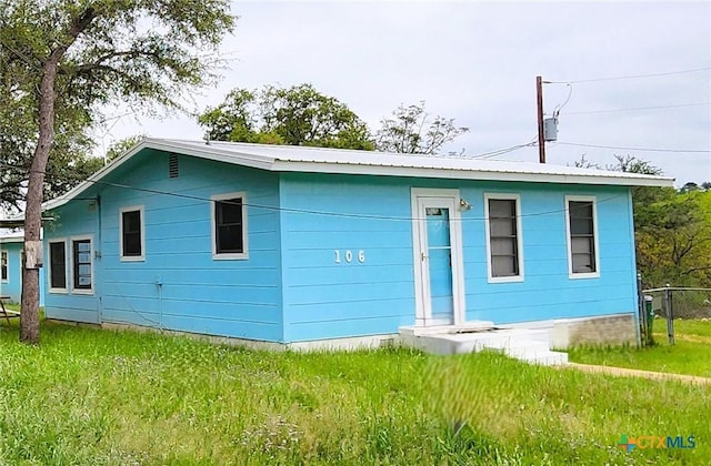 106 Beach Dr, Sunrise Beach, TX 78643 - view of front of property featuring metal roof