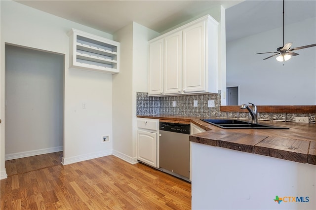 kitchen with light hardwood / wood-style floors, white cabinetry, sink, and dishwasher