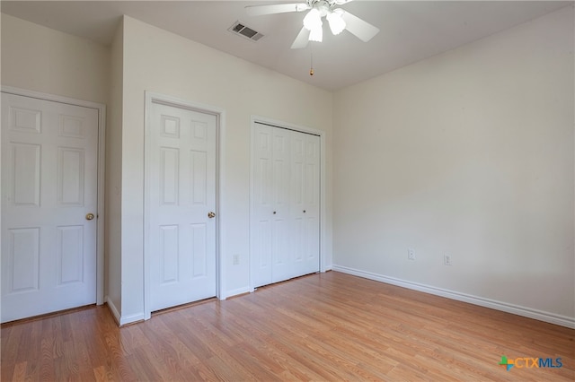 unfurnished bedroom with light hardwood / wood-style floors and ceiling fan