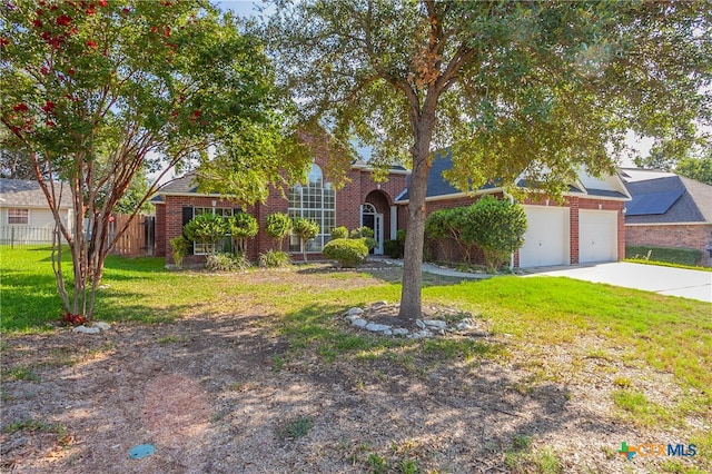 view of front of house featuring a garage and a front yard