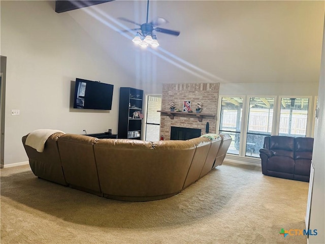 living room with ceiling fan, a fireplace, high vaulted ceiling, light colored carpet, and beam ceiling