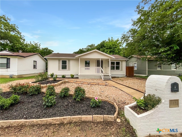 single story home with covered porch