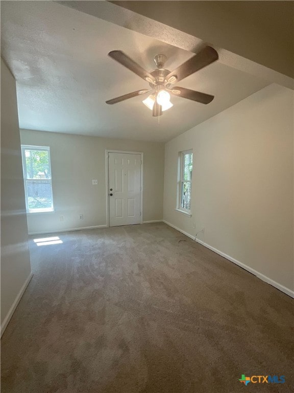 carpeted empty room with ceiling fan