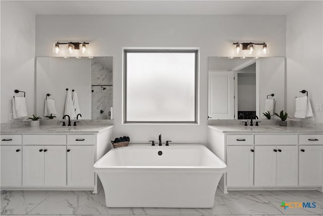 bathroom featuring a sink, walk in shower, and marble finish floor