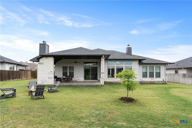rear view of house featuring a chimney, ceiling fan, fence private yard, and a patio