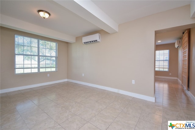 tiled spare room with beamed ceiling and a wall unit AC