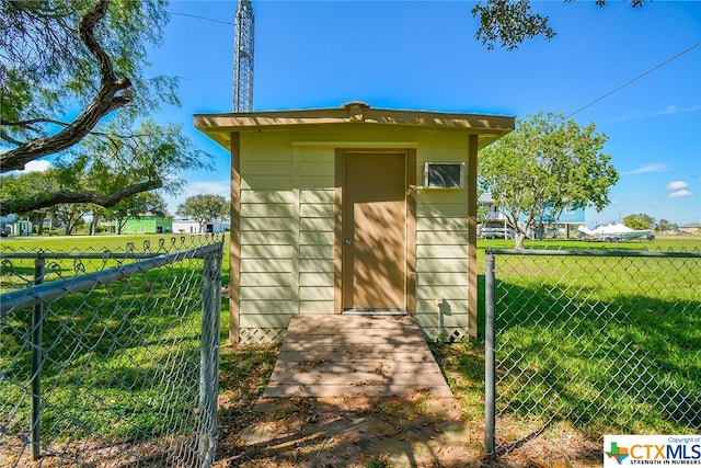 view of outbuilding with a lawn