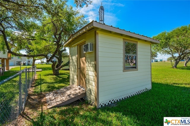 view of outbuilding featuring a yard