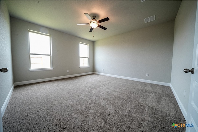 carpeted empty room with ceiling fan