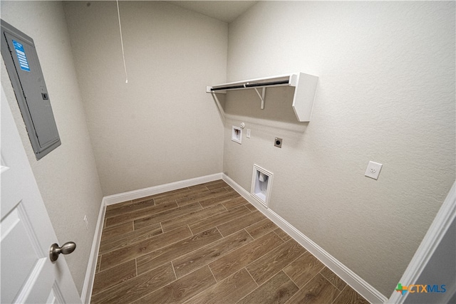 laundry area with electric panel, gas dryer hookup, hookup for an electric dryer, washer hookup, and dark wood-type flooring