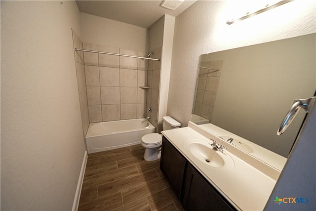 213 Fillmore Fls, Cibolo, TX 78108 - full bathroom featuring toilet, vanity, washtub / shower combination, and wood tiled floors