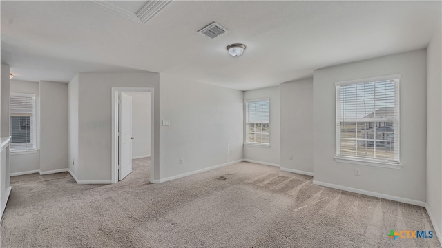 empty room with light colored carpet