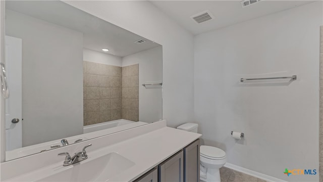 full bathroom with vanity, tile patterned floors, toilet, and tiled shower / bath