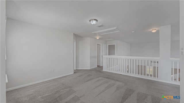 empty room featuring light carpet