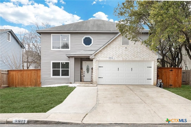 front facade featuring a garage and a front lawn