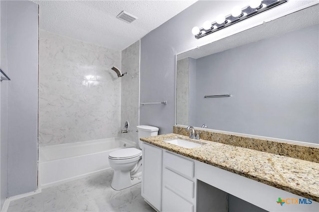 full bathroom featuring tiled shower / bath combo, vanity, a textured ceiling, and toilet