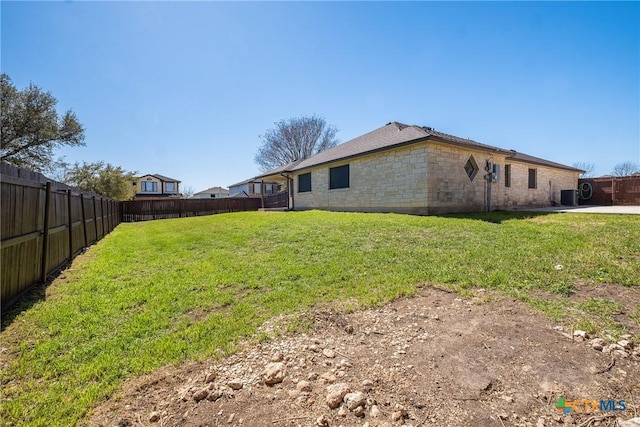 view of yard with a fenced backyard