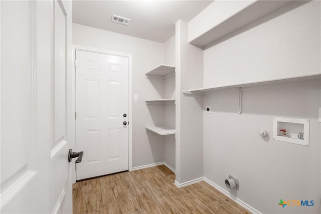 laundry room with visible vents, washer hookup, light wood finished floors, gas dryer hookup, and laundry area