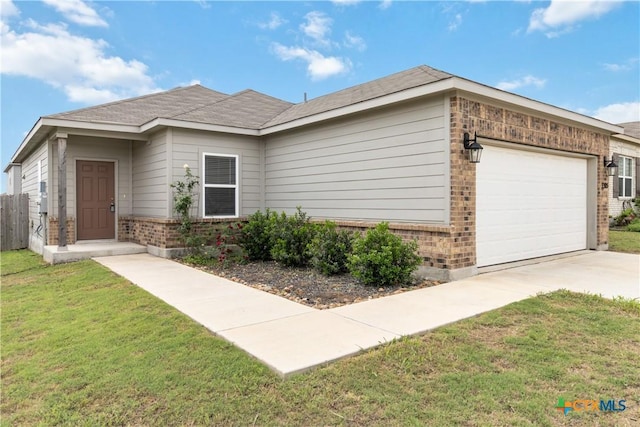 single story home with driveway, a front yard, brick siding, fence, and an attached garage
