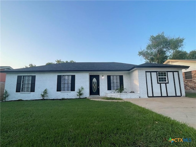 1218 Paseo Del Cobre, Temple, TX 76502 - ranch-style house featuring brick siding, a front lawn, and driveway