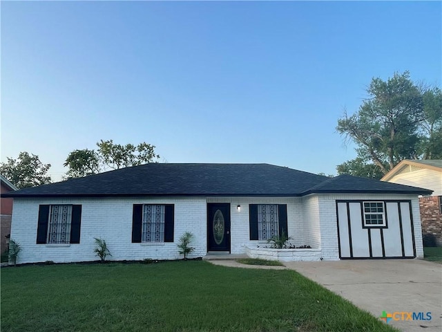 1218 Paseo Del Cobre, Temple, TX 76502 - ranch-style home featuring brick siding, a front lawn, and driveway