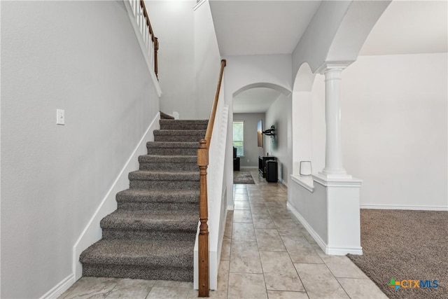 3225 Vineyard Trl, Harker Heights, TX 76548 - stairs featuring arched walkways, ornate columns, and tile patterned flooring