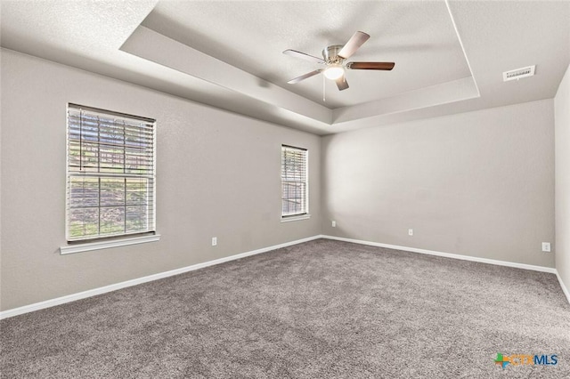 1536 Justice Dr, Copperas Cove, TX 76522 - carpeted spare room featuring a tray ceiling and a ceiling fan