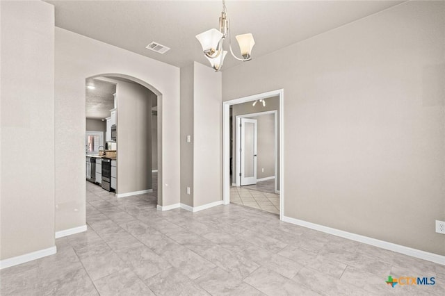1536 Justice Dr, Copperas Cove, TX 76522 - unfurnished room with arched walkways and a chandelier