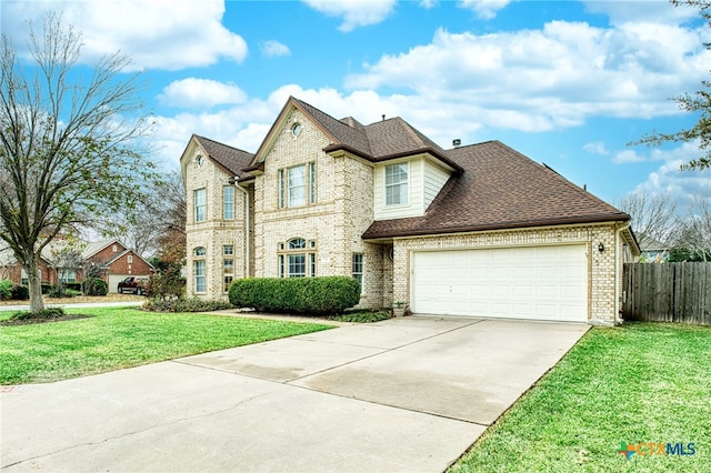 view of front of home with a garage and a front yard