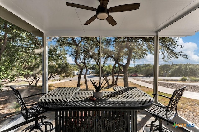 sunroom / solarium with ceiling fan