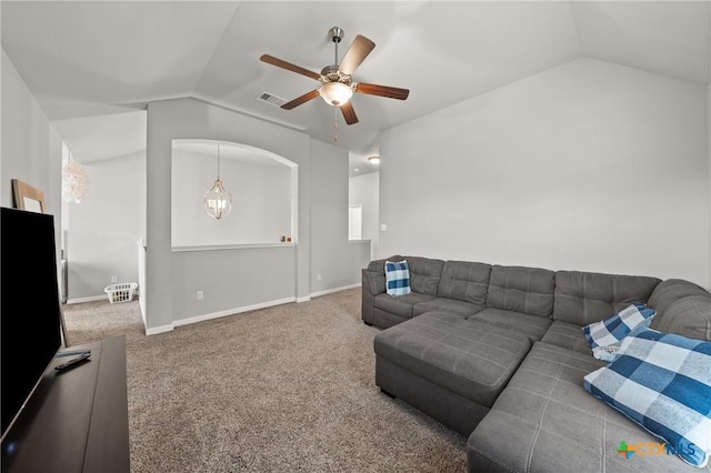 living room featuring ceiling fan, carpet flooring, and lofted ceiling