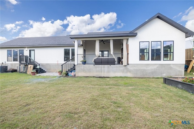1428 Springwater, Canyon Lake, TX 78133 - rear view of house with stairway, a ceiling fan, stucco siding, and a yard