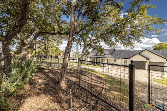 1428 Springwater, Canyon Lake, TX 78133 - view of yard with a garage and concrete driveway