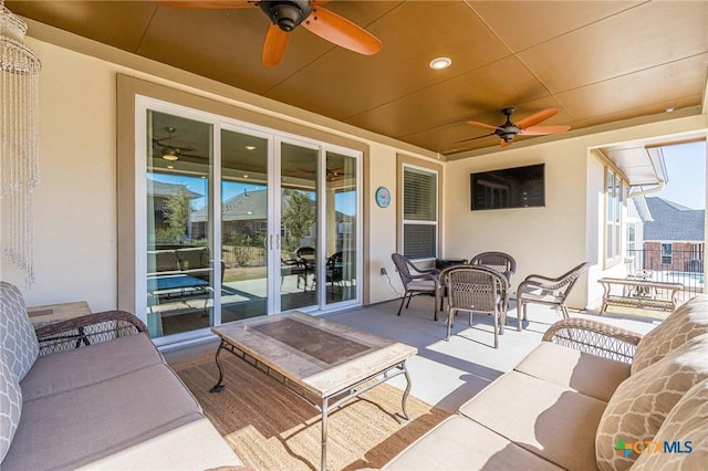 view of patio / terrace with ceiling fan, outdoor dining space, and outdoor lounge area