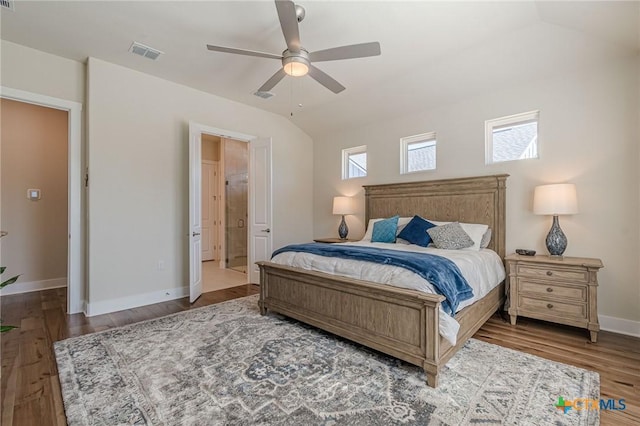 bedroom with visible vents, ceiling fan, baseboards, vaulted ceiling, and wood finished floors