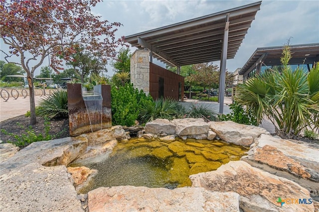 view of yard with a garden pond