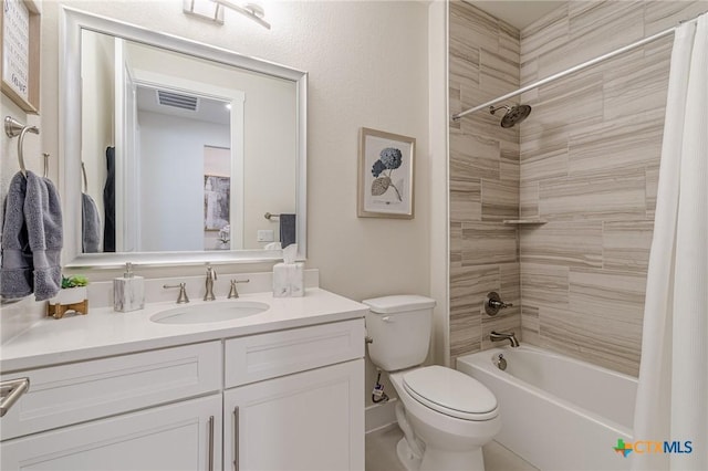 full bath with visible vents, toilet, vanity, and shower / bathtub combination with curtain