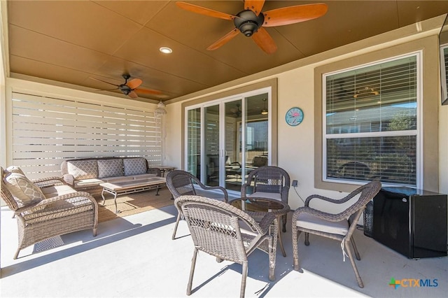 view of patio featuring outdoor lounge area and a ceiling fan