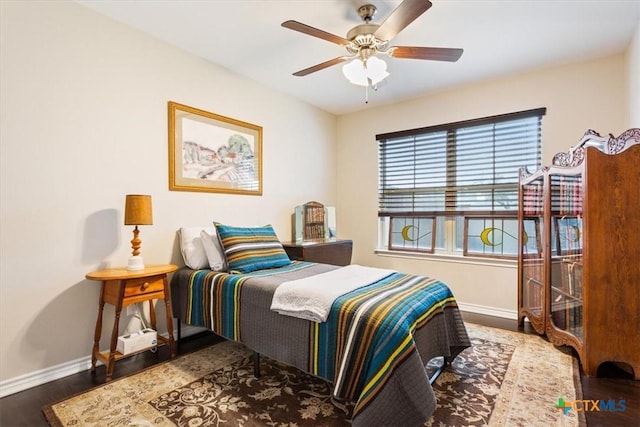 bedroom featuring ceiling fan and hardwood / wood-style floors