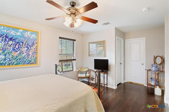 bedroom featuring ceiling fan and dark wood-type flooring