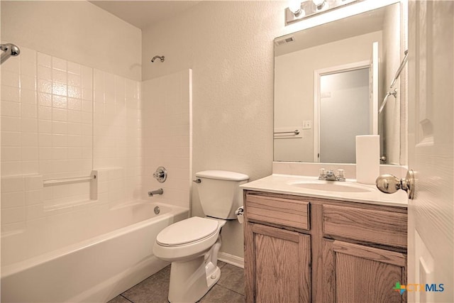 full bathroom featuring tile patterned floors, shower / bath combination, vanity, and toilet