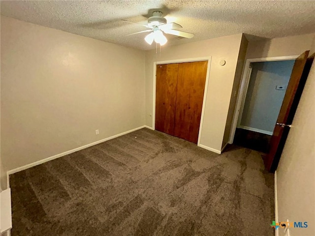 101 Chantilly St, Victoria, TX 77904 - unfurnished bedroom featuring a textured ceiling, carpet, baseboards, a closet, and a ceiling fan