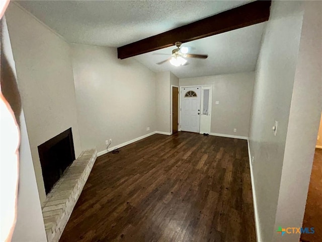 101 Chantilly St, Victoria, TX 77904 - unfurnished living room featuring wood finished floors, ceiling fan, a brick fireplace, baseboards, and a textured ceiling