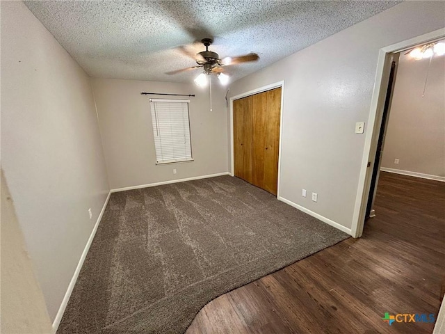101 Chantilly St, Victoria, TX 77904 - unfurnished bedroom featuring a textured ceiling, a closet, baseboards, wood finished floors, and a ceiling fan