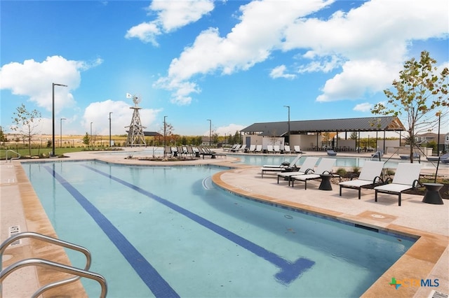 view of pool featuring a patio