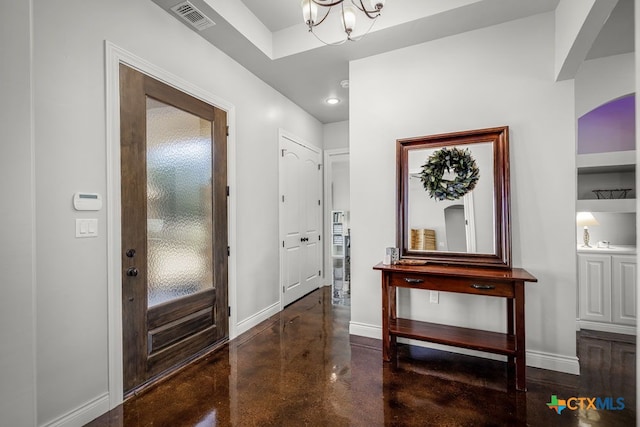 750 Cambridge Dr, New Braunfels, TX 78132 - foyer with concrete floors, baseboards, a chandelier, arched walkways, and recessed lighting