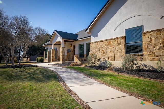 750 Cambridge Dr, New Braunfels, TX 78132 - view of front of property with stone siding, stucco siding, and a front yard